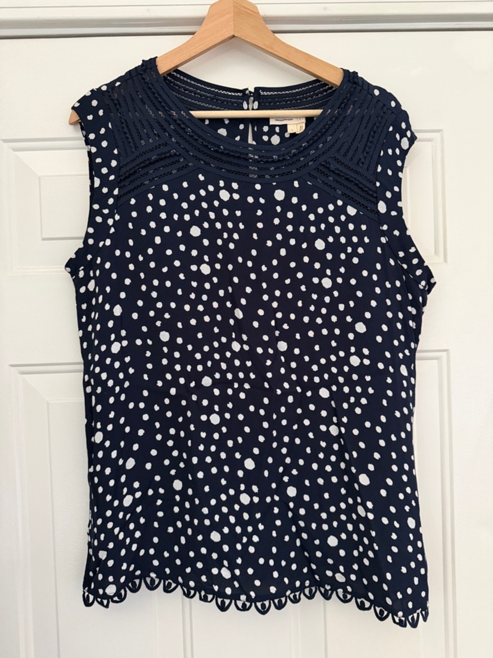 Anthropologie brand Meadow Rue Navy and White Polka Dot Lace-Trim Sleeveless Top